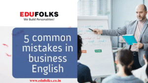 a man pointing at a whiteboard